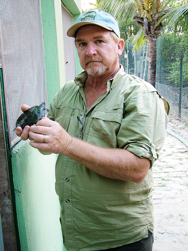 Lonnie Mcaskill and a yearling Northern river terrapin